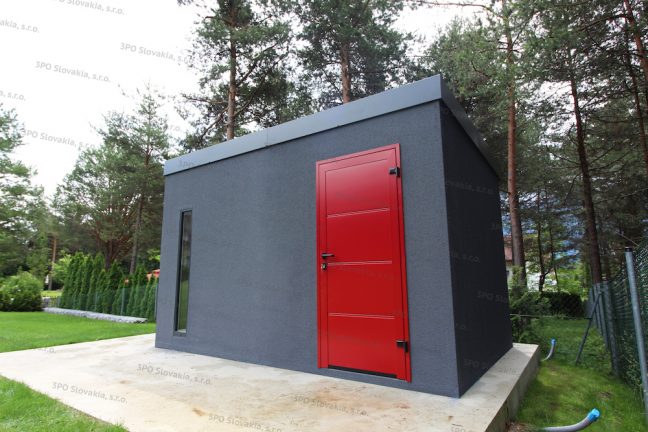 Ein montiertes Gartenhaus in dunkel-grau mit einer roten LPU40 Tür von Hörmann