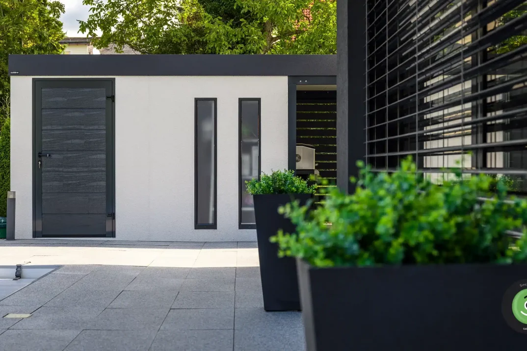 Designvolles Gartenhaus, das zu jedem Familienhaus passt